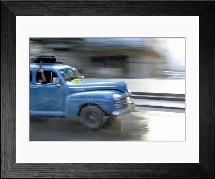 Framed Print : Panned shot of old American car splashing through puddle on Prado, Havana Framed Print : Panned shot of old American car splashing through puddle on Prado, Havana
