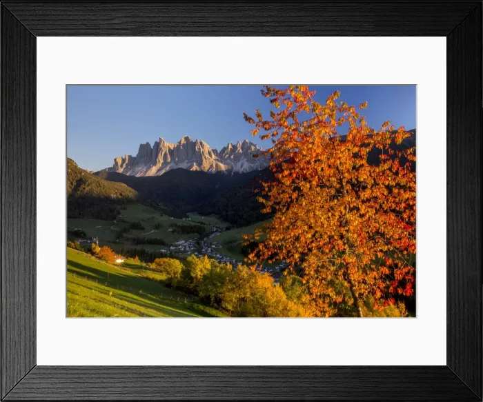 Framed Print : Colorful autumn trees frame the group of Odle and the village of St. Magdalena, Funes Valley Framed Print : Colorful autumn trees frame the group of Odle and the village of St. Magdalena, Funes Valley