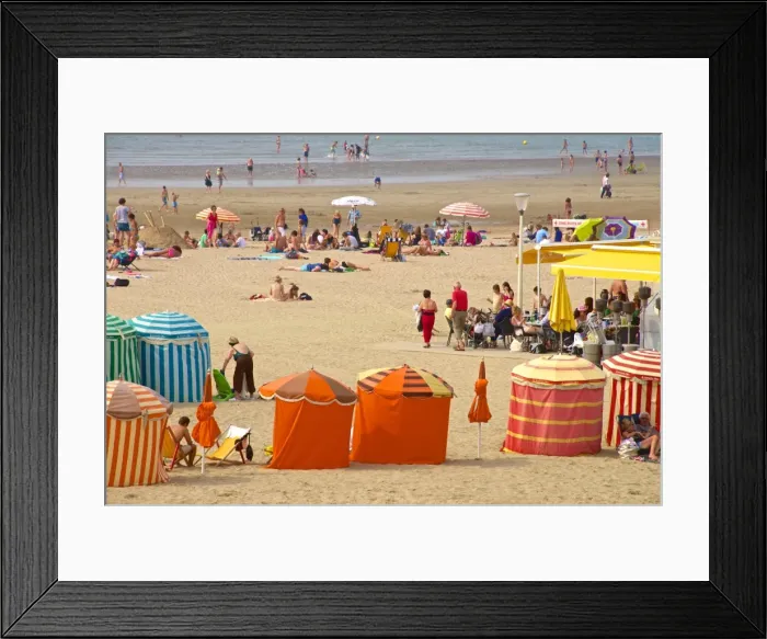 Framed Print : Typical color striped beach cabins, tourists, beach and sea, Trouville sur Mer, Normandy Framed Print : Typical color striped beach cabins, tourists, beach and sea, Trouville sur Mer, Normandy