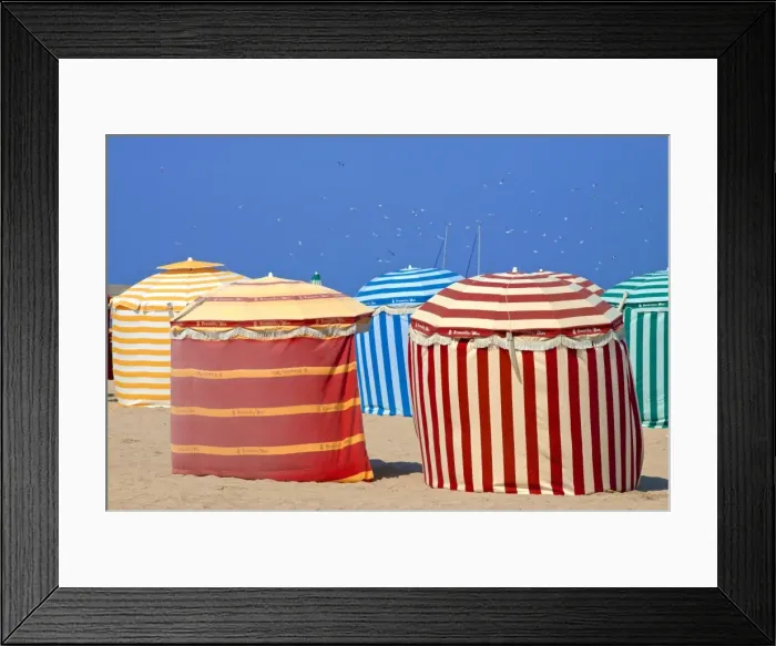 Framed Print : Typical color striped beach cabins, beach and sea, Trouville sur Mer, Normandy, France Framed Print : Typical color striped beach cabins, beach and sea, Trouville sur Mer, Normandy, France