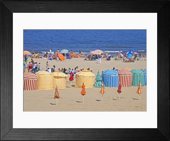 Framed Print : Typical color striped beach cabins, tourists, beach and sea, Trouville sur Mer, Normandy Framed Print : Typical color striped beach cabins, tourists, beach and sea, Trouville sur Mer, Normandy
