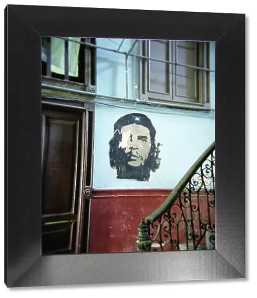 Image of Che Guevara on wall outside apartment, Havana, Cuba, West Indies