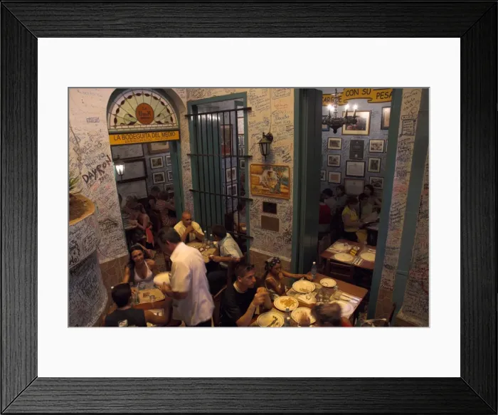 Framed Print : La Bodeguita del Medio restaurant, with signed walls and people eating at tables Framed Print : La Bodeguita del Medio restaurant, with signed walls and people eating at tables