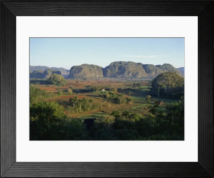 Framed Print : Landscape view of fields and trees in valley, with hills beyond, Vinales Valley Framed Print : Landscape view of fields and trees in valley, with hills beyond, Vinales Valley