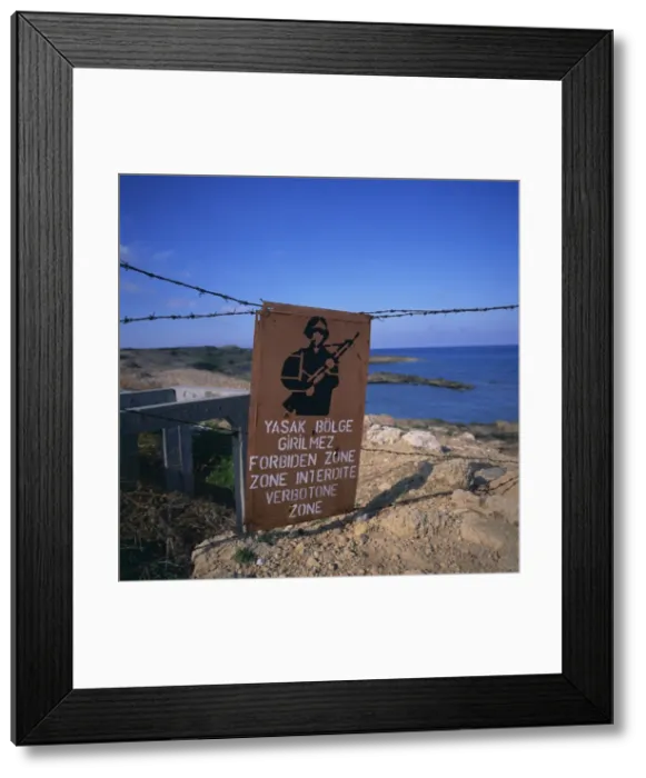Framed Print : Barbed wire and forbidden zone sign of Turkish Military zone, common following 20 July 1974 invasion, near Lapta, Lambousa, North Framed Print : Barbed wire and forbidden zone sign of Turkish Military zone, common following 20 July 1974 invasion, near Lapta, Lambousa, North