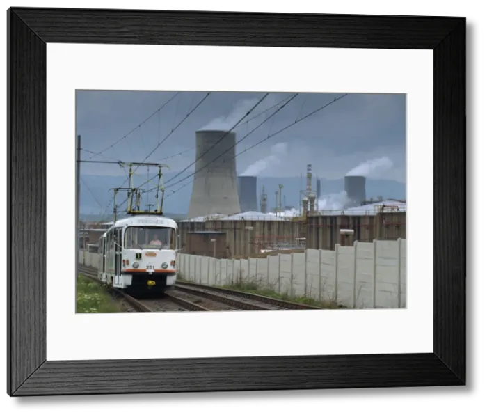 Framed Print : A tram passing a petrochemical plant near Most, North Bohemia, Czech Republic, Europe Framed Print : A tram passing a petrochemical plant near Most, North Bohemia, Czech Republic, Europe