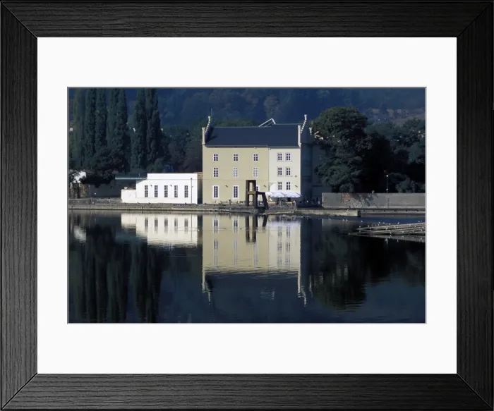 Framed Print : Exterior of the Sovovy Mlyny Gallery with statue of chair in front of it Framed Print : Exterior of the Sovovy Mlyny Gallery with statue of chair in front of it