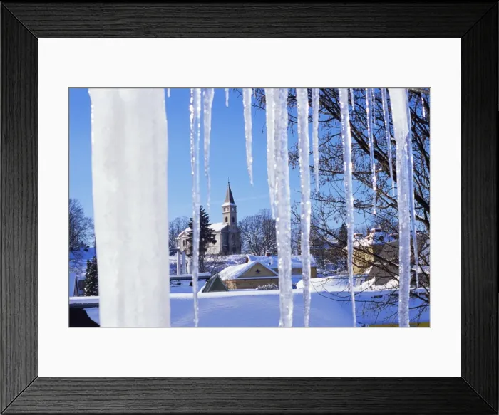 Framed Print : Catholic church in village of Luceny nad Nisou, Jizerske mountains, seen through icicles Framed Print : Catholic church in village of Luceny nad Nisou, Jizerske mountains, seen through icicles