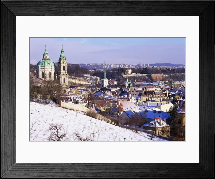 Framed Print : Snow covered Schonbornska Garden, Baroque St. Nicholas church and Mala Strana suburb rooftops in winter, Hradcany, Prague, Czech