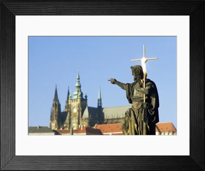 Framed Print : Statue of St. John the Baptist, dating from 1857, on Charles Bridge, pointing to Gothic St Framed Print : Statue of St. John the Baptist, dating from 1857, on Charles Bridge, pointing to Gothic St