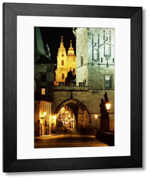 Framed Print : Romanesque and Gothic Malostranske bridge towers, with the two towers of Baroque St Framed Print : Romanesque and Gothic Malostranske bridge towers, with the two towers of Baroque St