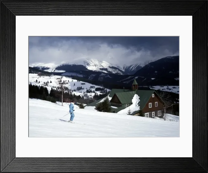 Framed Print : Winter view of skier on slopes at Pec Pod Snezkou with Snezka Mountain Framed Print : Winter view of skier on slopes at Pec Pod Snezkou with Snezka Mountain
