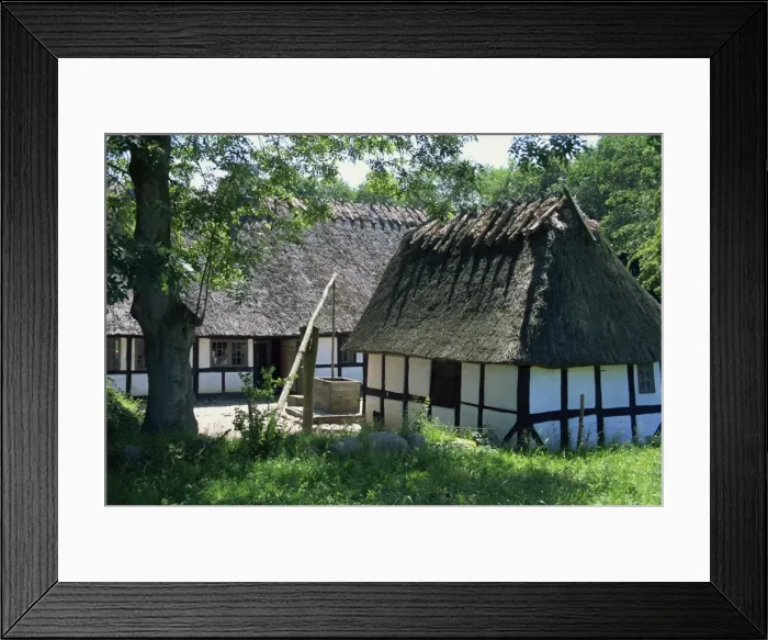 Framed Print : Thatched timber framed buildings and water well at the Hule Farm Village Museum
