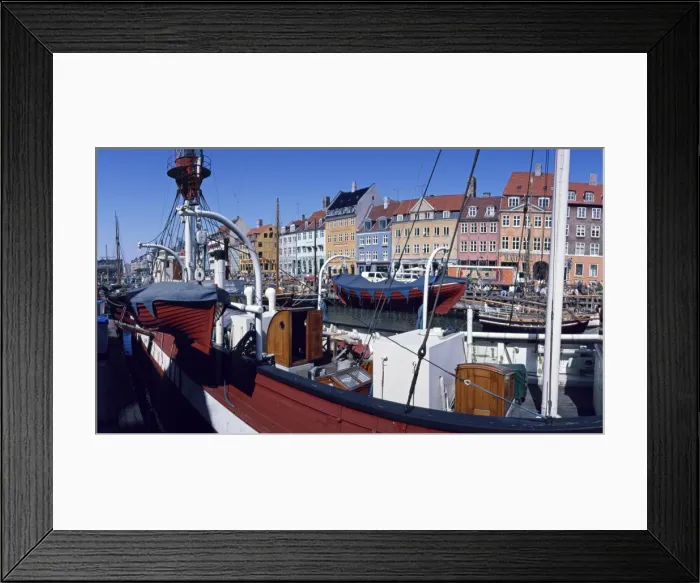 Framed Print : Moored boats and the waterfront of the Nyhavn Channel, the old harbour of Copenhagen Framed Print : Moored boats and the waterfront of the Nyhavn Channel, the old harbour of Copenhagen