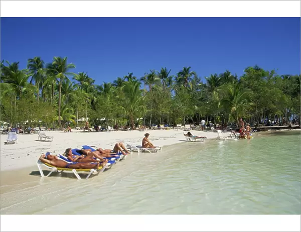 Tourists on beach, Punta Cana, Dominican Republic, West Indies, Caribbean