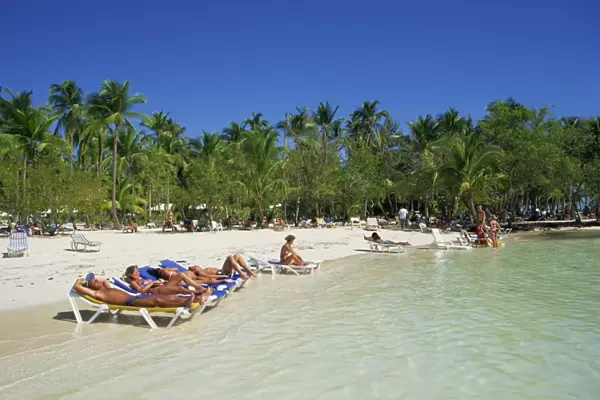 Tourists on beach, Punta Cana, Dominican Republic, West Indies, Caribbean