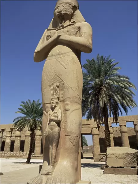 Ramses II and daughter Bant Anta, in forecourt of the temple of Karnak