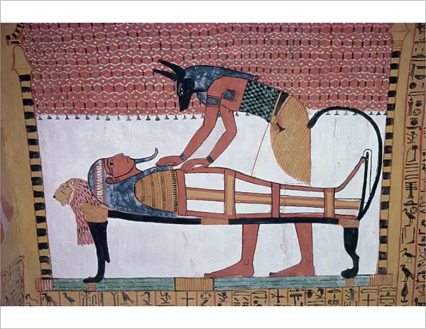 Mural showing the god Anubis leaning over mummy of Ramses II, in the Tomb of Sinjin