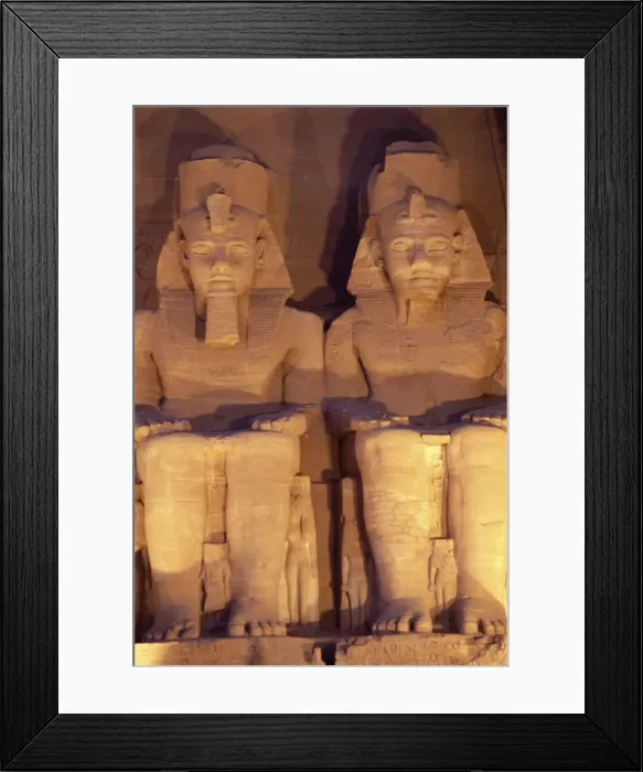 Framed Print : Floodlit colossi of Ramses II (Ramesses the Great), seated statues on facade of temple Framed Print : Floodlit colossi of Ramses II (Ramesses the Great), seated statues on facade of temple