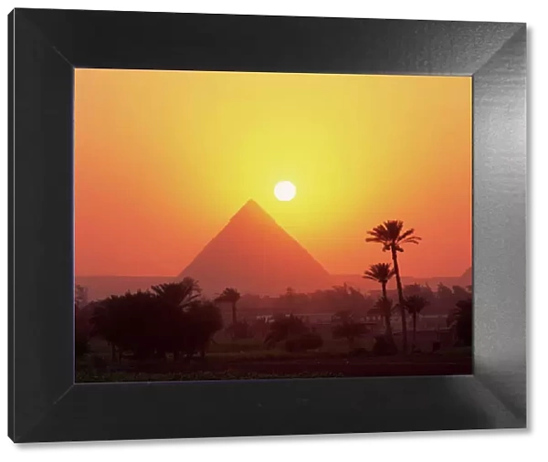 Pyramid silhouetted at sunset, Giza, UNESCO World Heritage Site, Cairo
