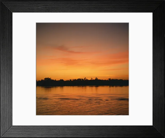 Framed Print : The River Nile at sunset, water reflecting evening sky, in Egypt, North Africa, Africa Framed Print : The River Nile at sunset, water reflecting evening sky, in Egypt, North Africa, Africa