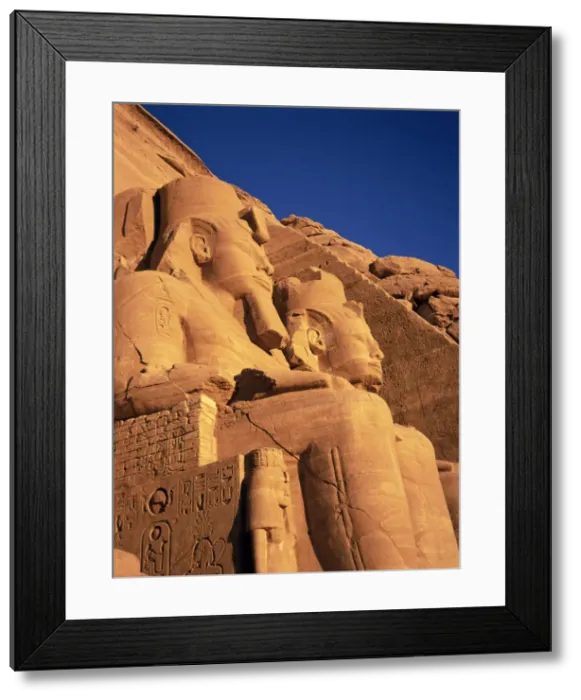 Framed Print : Large carved seated statues of the pharaoh, Temple of Rameses II (Ramasses II) Framed Print : Large carved seated statues of the pharaoh, Temple of Rameses II (Ramasses II)