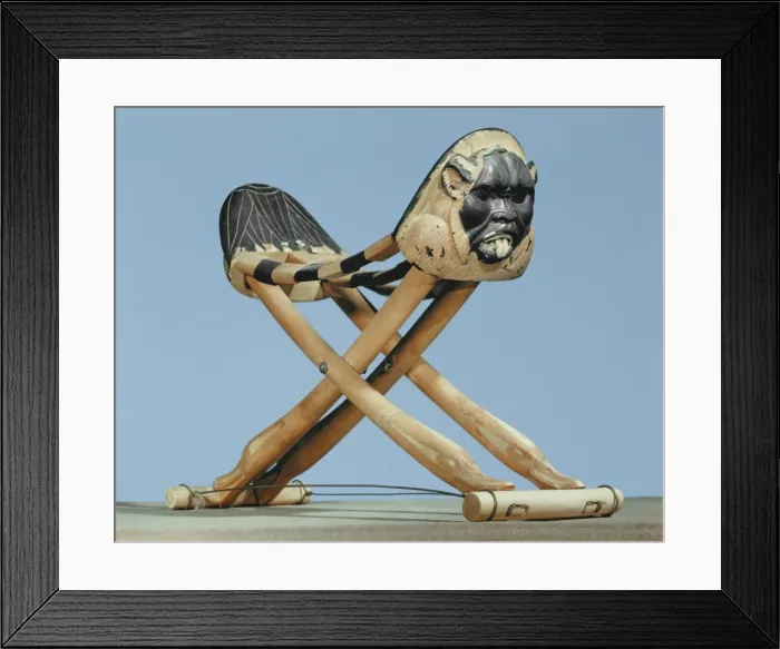 Framed Print : Folding headrest in painted ivory decorated with the head of the protective spirit Bes Framed Print : Folding headrest in painted ivory decorated with the head of the protective spirit Bes