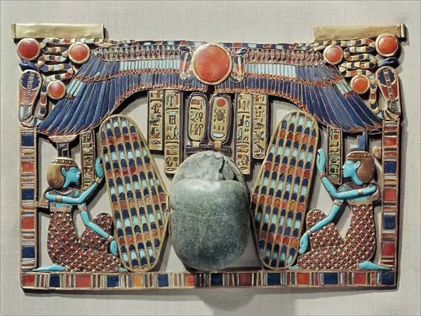 Pectoral decorated with winged scarab, protected by the goddesses Isis and Nephthys