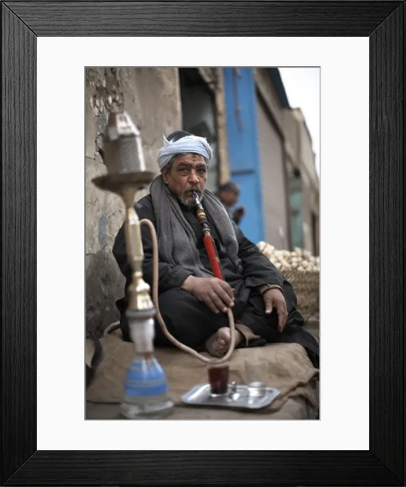Framed Print : A man smokes sheesha in the Khan al-Khalili area of Cairo, Egypt, North Africa, Africa Framed Print : A man smokes sheesha in the Khan al-Khalili area of Cairo, Egypt, North Africa, Africa