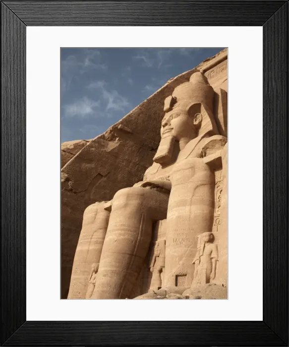 Framed Print : A colossal statue of Ramses II sits at the entrance to the Great Temple of Abu Simbel