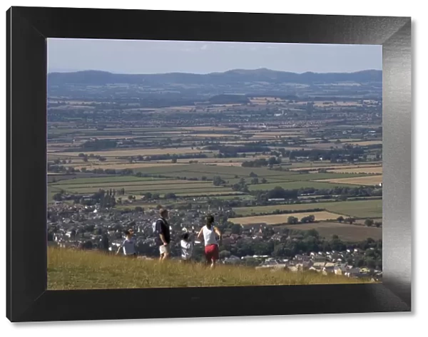 Family walking on Cleeve Hill, above Bishops Cleeve village, The Cotswolds