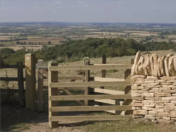 Refurbished gate and dry stone wall on the Cotswold Way footpath, Dover Hill near Chipping Campden