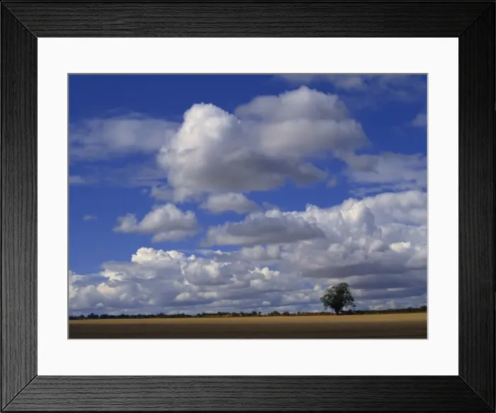 Framed Print : Blue sky with white clouds over farmland near Burford, Oxfordshire, England Framed Print : Blue sky with white clouds over farmland near Burford, Oxfordshire, England