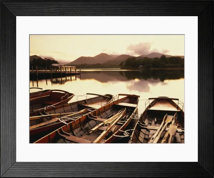 Framed Print : Tranquil scene at sunset over Derwentwater and Derwent Isle with pleasure boats Framed Print : Tranquil scene at sunset over Derwentwater and Derwent Isle with pleasure boats