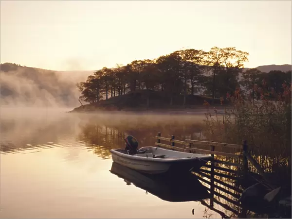 Early morning mist and boat, Derwent Water, Lake District, Cumbria, England