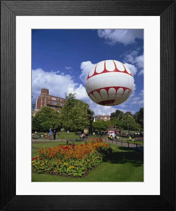 Framed Print : The Bournemouth Eye in Lower Gardens, the tethered balloon gives rides up to 500 feet above the town, Bournemouth, Dorset, England, United Framed Print : The Bournemouth Eye in Lower Gardens, the tethered balloon gives rides up to 500 feet above the town, Bournemouth, Dorset, England, United