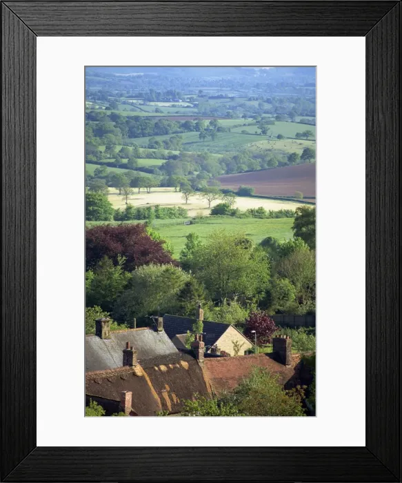 Framed Print : Roofs of houses in Shaftesbury and typical patchwork fields beyond, Dorset