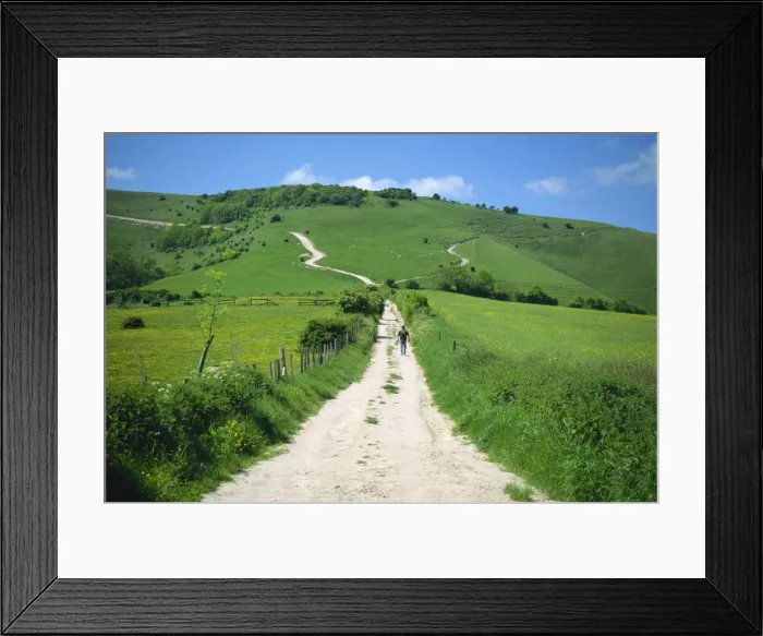 Framed Print : Figure on a pathway leading up a hill in the South Downs, near Lewes, Sussex Framed Print : Figure on a pathway leading up a hill in the South Downs, near Lewes, Sussex