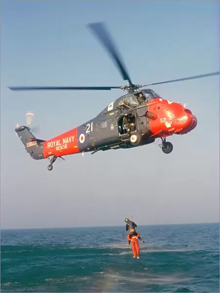 Wessex helicopter winching up survivior in rescue from sea