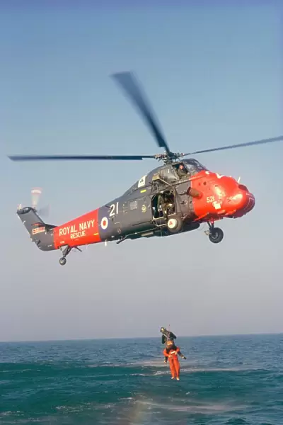 Wessex helicopter winching up survivior in rescue from sea