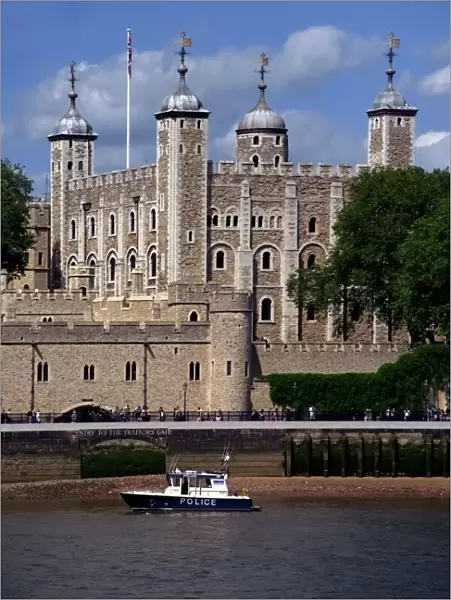 A police launch on the River Thames, passing the Tower of London, UNESCO World Heritage Site