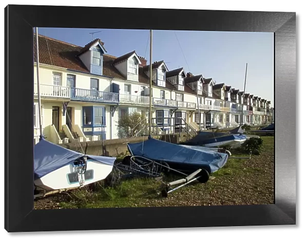 Sailing boats and holiday homes on the seafront, Whitstable, Kent, England