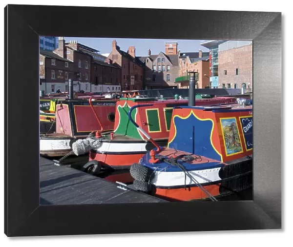 Narrow boats and barges moored at Gas Street Canal Basin, city centre, Birmingham