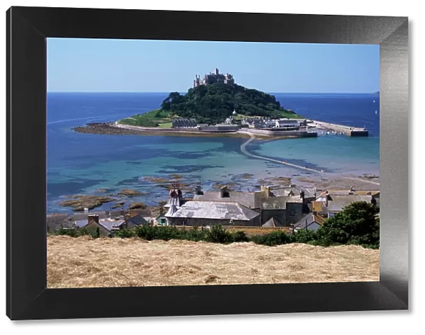Submerged causeway at high tide, seen over rooftops of Marazion, St. Michaels Mount
