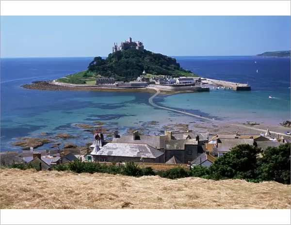 Submerged causeway at high tide, seen over rooftops of Marazion, St. Michaels Mount