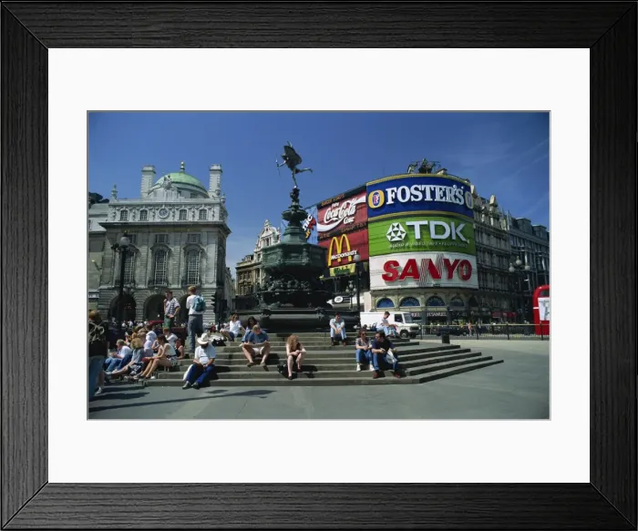 Framed Print : People sitting on steps below the Statue of Eros, Greek God of Love, erected in 1892 in memory of the Earl of Shaftesbury, Piccadilly Circus, London, England, United Framed Print : People sitting on steps below the Statue of Eros, Greek God of Love, erected in 1892 in memory of the Earl of Shaftesbury, Piccadilly Circus, London, England, United