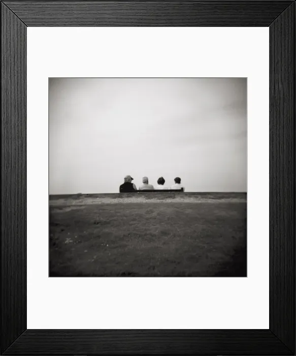 Framed Print : Image taken with a Holga medium format 120 film toy camera of four people on a bench overlooking the sea, Freshwater Bay, Isle of Wight, Hampshire, England, United Framed Print : Image taken with a Holga medium format 120 film toy camera of four people on a bench overlooking the sea, Freshwater Bay, Isle of Wight, Hampshire, England, United