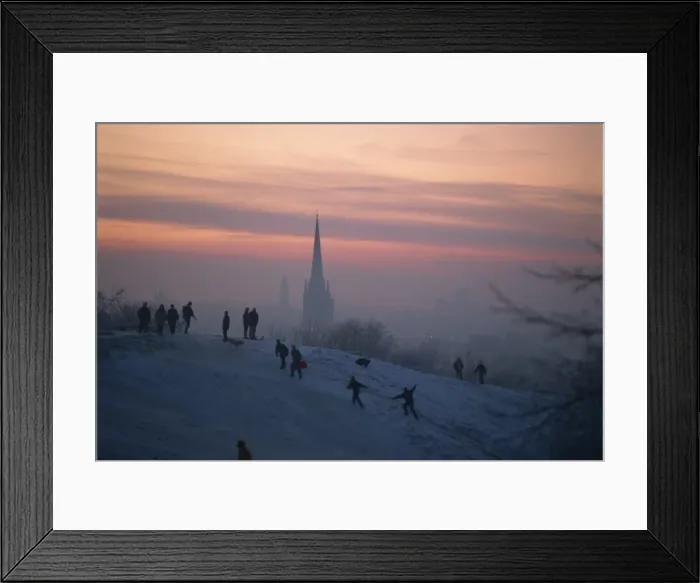 Framed Print : People in a winter landscape with snow on the ground and Norwich Cathedral in the background Framed Print : People in a winter landscape with snow on the ground and Norwich Cathedral in the background