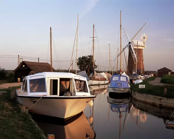 Boats moored near Horsey windmill, Norfolk Broads, Norfolk, England, United Kingdom