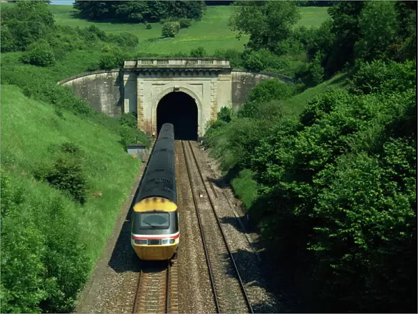 High speed train emerging from tunnel in the Box Valley, Avon, England
